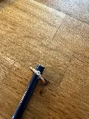 You found a ring that appears to be made of gold and features a stone that resem