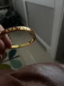 Gold bangle/bracelet with red love hearts 