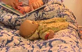 Hi! Please could you let us know if you see a baby doll in a yellow outfit? Last