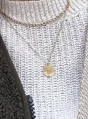 I lost a golden necklace with a coin which has my sister‘s fingerprint engraved.