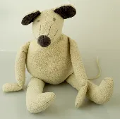A grey cuddly toy of a mouse / mammal animal, long limbs - long arms and long le