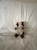 Small black and white cow teddy. I’ve had it for 30 years so it is quite rough l