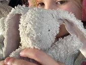 Small pink bunny with one arm missing and very worn. Belongs to my 4 year old da