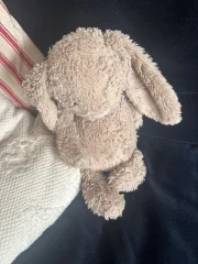 Lost beige jellycat with stitched up hole on its nose. Well-loved for 8 years. N