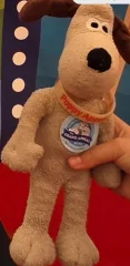 Gromit, soft toy, (wallace and gromit)wearing a childs white poppy charity wrist