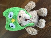 Teddy bear with green owl hat found in parking structure stairwell. 