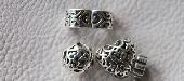 Several Silver Pandora charms and green stone Tikki on path between Dinham Bridg