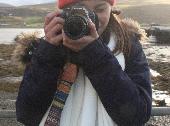 It's a Nikom D5300 camera with a patterned camera strap.