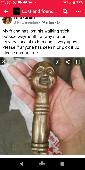 Left a walking stick with a four face buddha top.please it is very precious to m