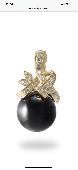 Lost 14k yellow gold black Hawaiian coral pendant with diamonds. Somewhere betwe
