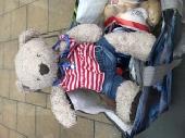 Sitting quietly at bus stop outside Catford theatre. Found bear. Wearing a smart