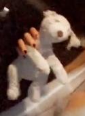 a grey old worn out teddy bear named scruffy, has been in the family for years, 