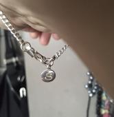 Hi, I lost a silver chain bracelet with a small round charm hanging from the clo