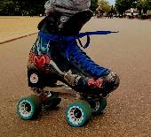 Blue/grey backpack with roller skates in , worth a huge amount both financially 