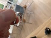 LOST: platinum (silver coloured) wedding ring, with "Camilla & Tim" engraved on 