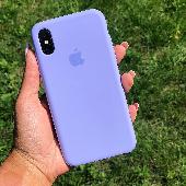 Iphone XR in a lilac case -monzo card attached behind the case -name of the card
