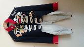 Unique military-style costume tailcoat with many badges. It was inside a black c