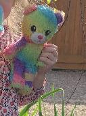 Small rainbow coloured teddy from build a bear. Much loved teddy was misplaced o