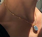Regrettably, I lost a gold necklace of great sentimental value with a blue penda