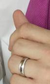 Lost wedding band, white gold with small diamonds around the edges that don’t me