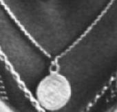 I lost a small greek gold coin on a silver chain. Reward if found.Thanks