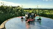 FPV Custom drone with gopro hero 6 strapped to it (with dark sun filter) it has 