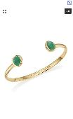 Gold cuff bracelet with two green onyx stones at each end 