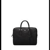 Did anyone find a black Prada bag, inside a black Lenovo, two passports and eyeg