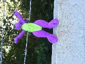 Found purple and green toy on fence on the edge of Clifford road. Left there bec