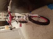 My daughter forgotten a kid dream bicycle Its a pink and white color 14" 
