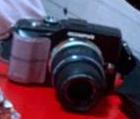 My camera is OLYMPUS PEN EPL2 (with the purple sticker tape in the hand grip) in