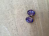 Found…red & blue stripped gold cufflink with inscribed date on reverse.