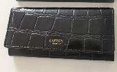 Black mock crocodile Osprey purse. Osprey written in gold on front. Cards drivin