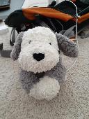 Stuffed puppy found at Salt Lake City airport. Has some unique markings and char