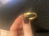 Gold hoop earring (herringbone in style) stamped m935 about an inch and half wid