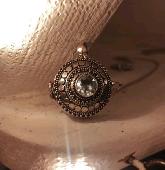 My fiancé lost a necklace pendant containing her father's ashes. Feels like a lo