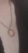 Gold ring on silver chain. Chain may have snapped and they may now be separate. 