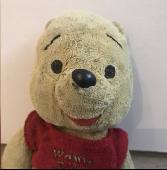 Small Winnie the Pooh teddy bear, well loved
