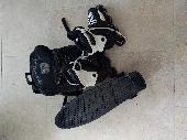 rollerblades, skateboard and backpack, left in our recycling bin near Leyton tub