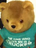 1998 teddy bear with turquoise shirt that says the one who loves me is a trucker