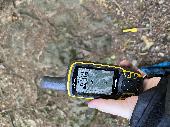A Garmin GPS, black and yellow with a crack on the top of the screen. my uni loa