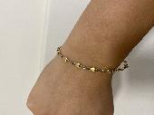 Lost gold bracelet with yellow gold hearts and white gold links.