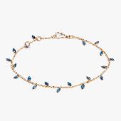Gold bracelet with small dark blue leaf shaped charms 