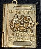 Gold passport charm fell off its chain while walking from fulham into putney. No