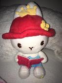 Book Bunny came from a claw machine in China. She has a red hat with a yellow fl