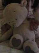 Please help reunite my daughters beloved teddy. Snowy is white with a scuffed no