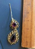 Gold earring with dark red stones, approximately 3cm long plus wire hook