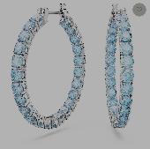 Silver looped earring with light blue gems the entire way around. 
