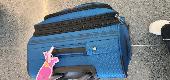A blue Swiss Gear suitcase was lost (or stolen) from the sidewalk in Bloomsbury 