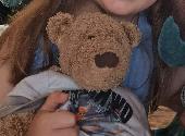 Lost a brown bear from hamleys wearing grey shorts and a white top with a name t